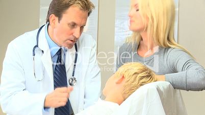 Little Boy With Doctor and Mother at Hospital Clinic