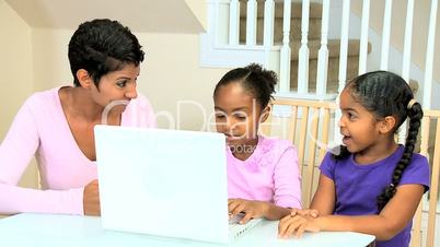 Little Ethnic Girls Using Laptop Computer