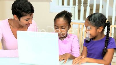 Cute Little African American Girls Playing on Laptop
