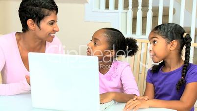 Little Ethnic Girls Using Laptop Computer