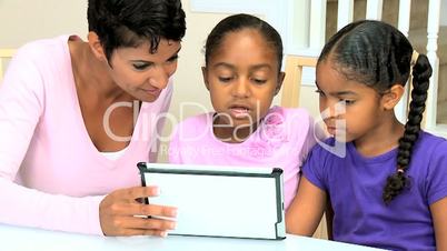 Cute Little African American Girls Playing Modern Tablet