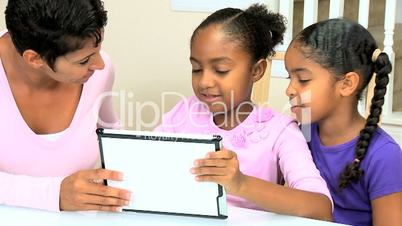 Cute Little African American Girls Playing Modern Tablet