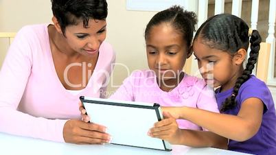 Cute Little African American Girls with Wireless Tablet