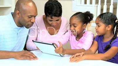 Young African American Family with Wireless Tablet