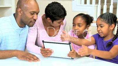 Young African American Family with Wireless Tablet