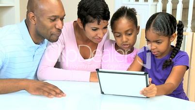 Young Ethnic Family Using Wireless Tablet
