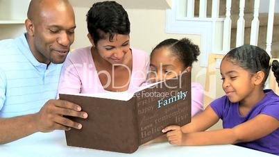 Young Ethnic Family with Photograph Album