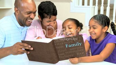 Young Ethnic Family with Photograph Album