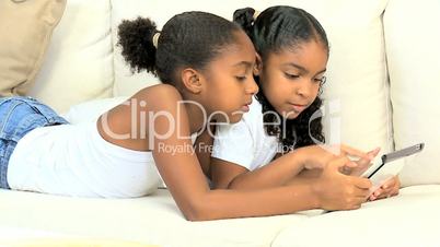 Little Ethnic Girls with Wireless Tablet