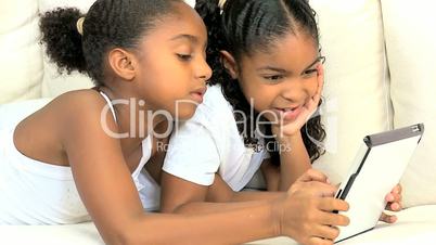 Young Ethnic Children Having Fun on Wireless Tablet