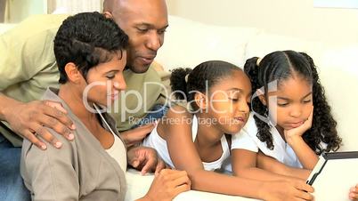 Young Ethnic Family Using Wireless Tablet