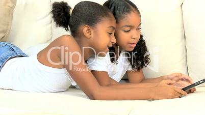 Young Ethnic Children Having Fun on Wireless Tablet