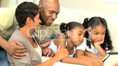 Young African American Family with Wireless Tablet