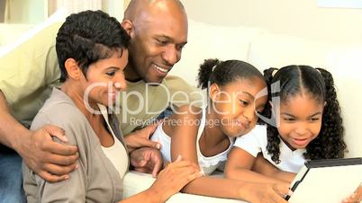 Young African American Family with Wireless Tablet