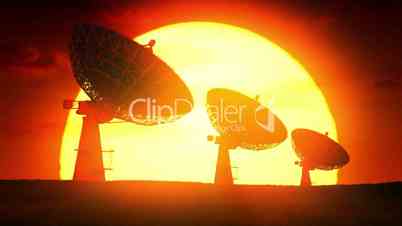 Satellite dishes at sunrise