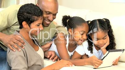 Young African American Family with Wireless Tablet