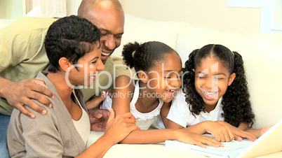 Cute Little African American Girls Playing on Laptop