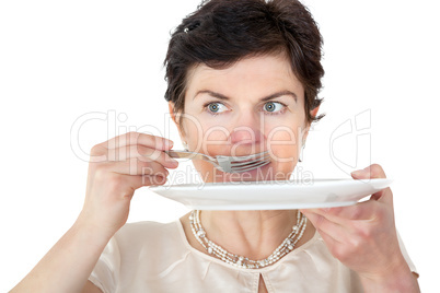 Woman with plate and fork in hand