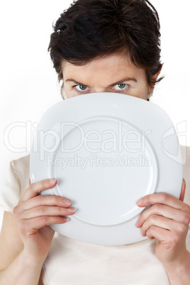 Woman with blank plate in his hand