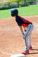 Teen baseball boy on base