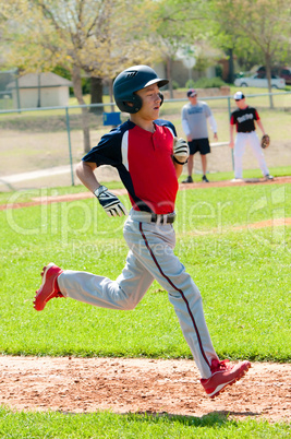 Teen baseball boy running