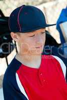 Teen Baseball boy in dugout