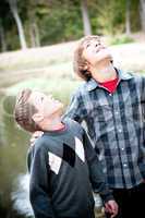 Two young boys looking up