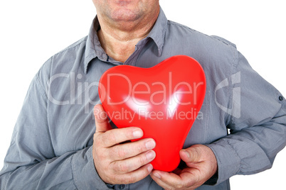 Elderly man holding red heart