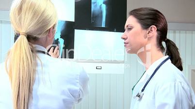 Caucasian Doctors Examining X-Ray Results