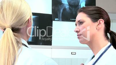 Caucasian Doctors Examining X-Ray Results