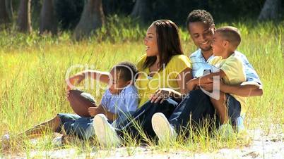 Portrait of Happy Ethnic Family in Park