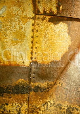 Rusted Metal Background with Rivet Holes and Seams