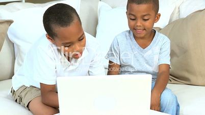 Cute Young Ethnic Boys with Laptop