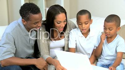 Little Ethnic Boys Using Laptop Computer with Parents