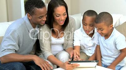 Young Family at Home Using a Wireless Tablet