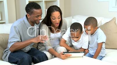 Young Boys and Their Parents With a Wireless Tablet