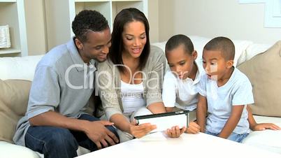 Young Boys and Their Parents With a Wireless Tablet