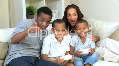 Ethnic Family Using Home Games Console