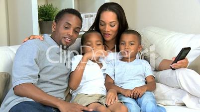 African American Family Watching TV Together