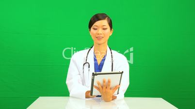 Asian Chinese Female Doctor Green Screen Tablet