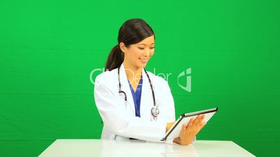 Asian Chinese Female Doctor Wireless Tablet Green Screen