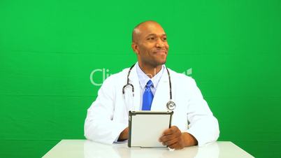 Ethic Male Doctor Wireless Tablet Green Screen