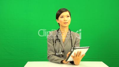 Asian Female Doctor Wireless Tablet Green Screen