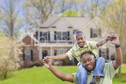 Playful African American Father and Son In Front of Home