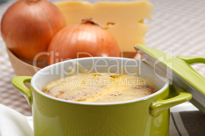 onion soup with melted cheese and bread on top