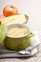 onion soup with melted cheese and bread on top