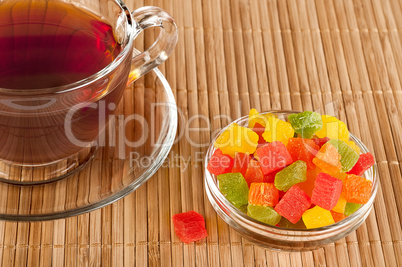 Cup of tea with candied fruits