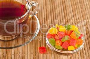 Cup of tea with candied fruits