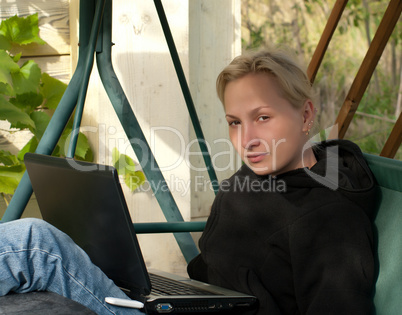 Blonde with laptop.