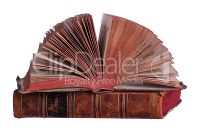 stack of old books with fanned pages